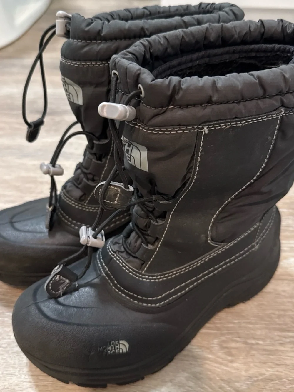 The North Face Kids Black Insulated Snow Boots with Bungee Closure